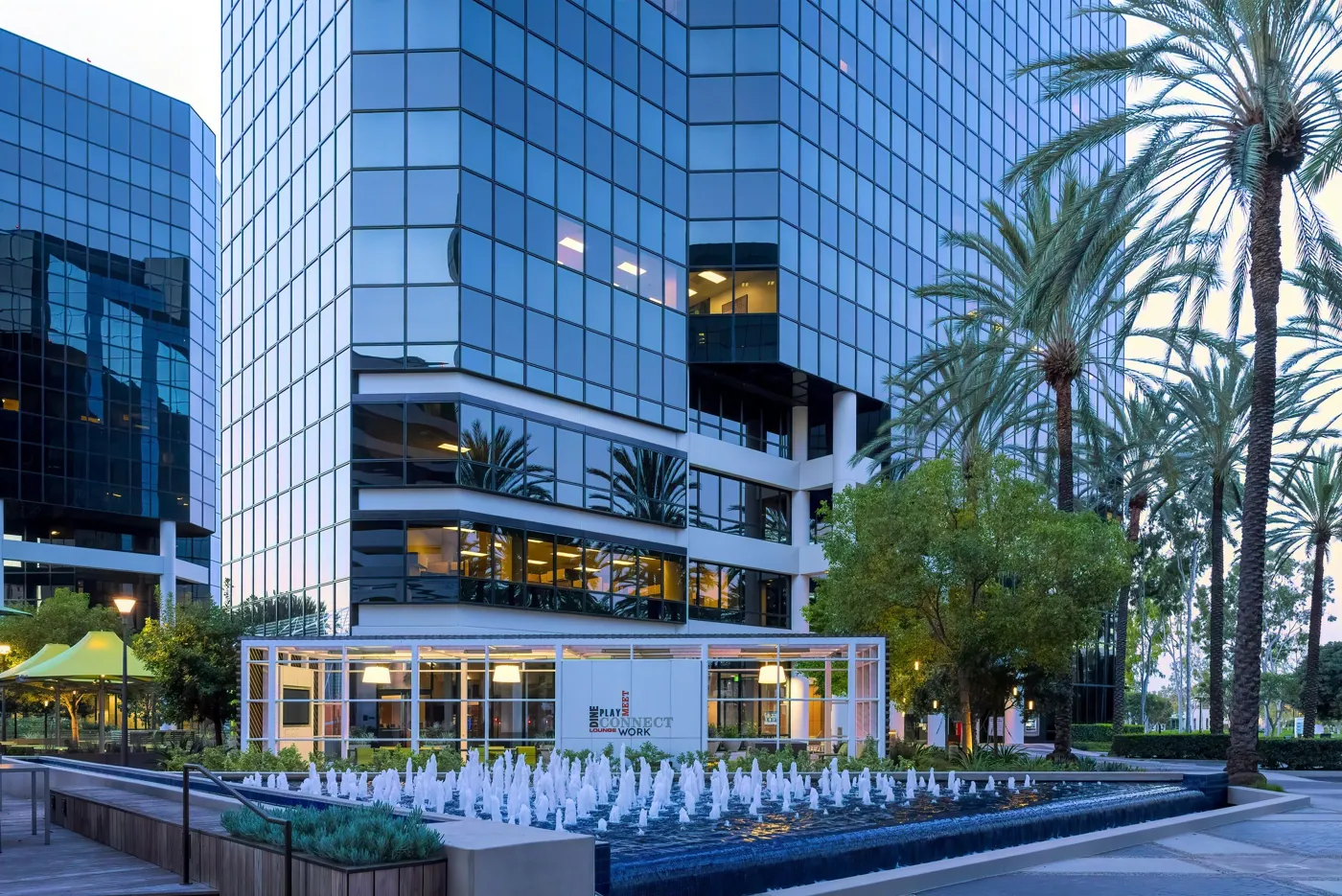 Glass office towers and palm trees in Orange County